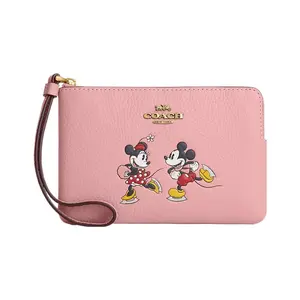 COACH Mickey Mouse Ice Skating Zip Wallet for Women – Pebbled Leather in Brass and Light Blush Multicolor