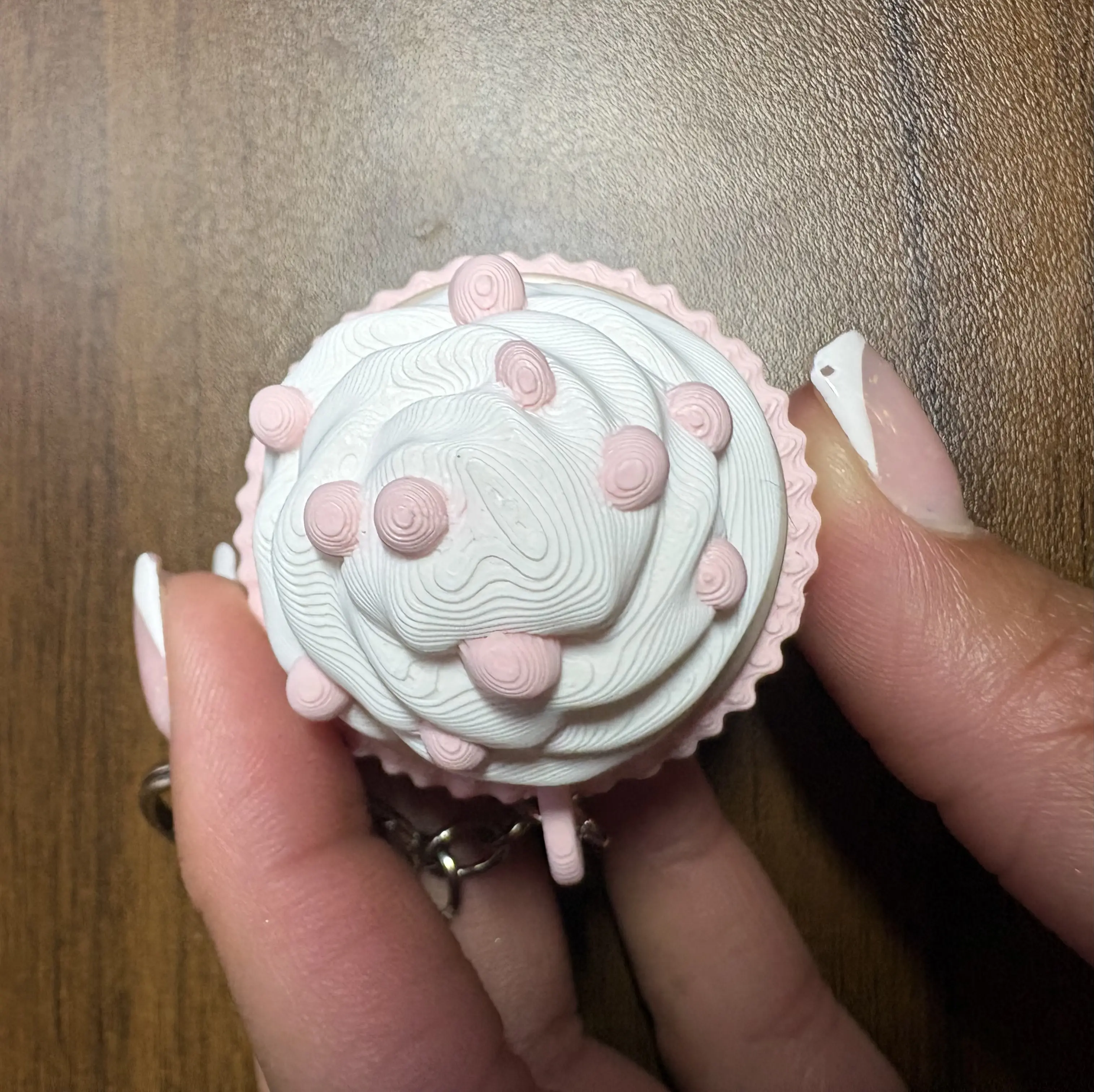 Cupcake Keychain with Pink and White Design, Featuring a Delightful Cupcake Shape and Adorable Details