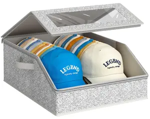 Baseball cap storage organizer box with slanted opening and clear lid, stackable hat holder for closet, grey fabric hat container with reinforced structure