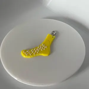 Yellow sock badge keychain