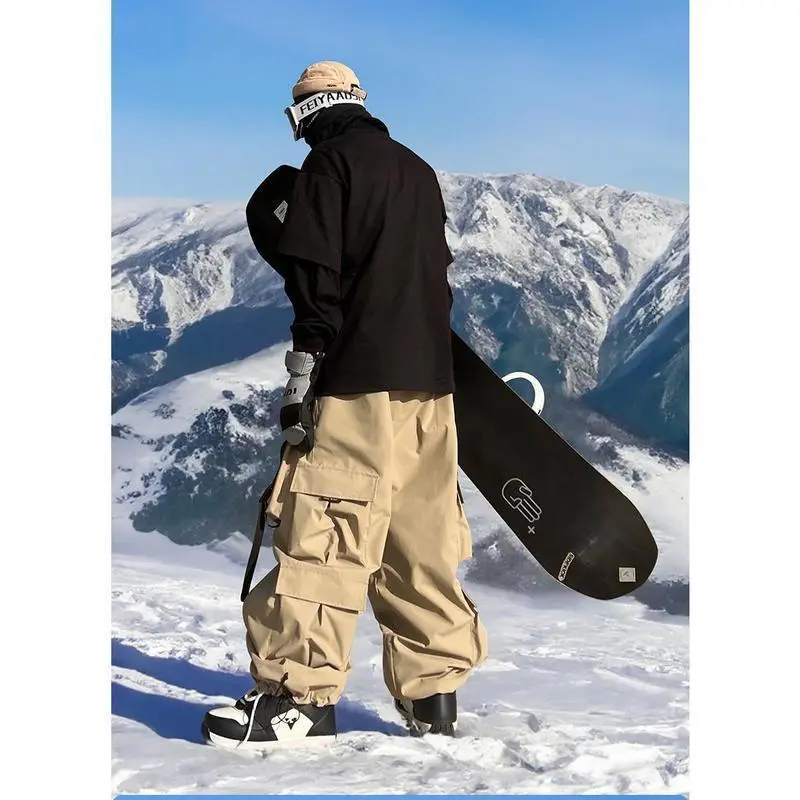 Men's and women's oversized ski pants are waterproof, breathable, warm, and lined with wool. They are winter work clothes and pants Men's and women's oversized ski pants are waterproof, breathable, warm, and lined with wool. They are winter work clothes and pants