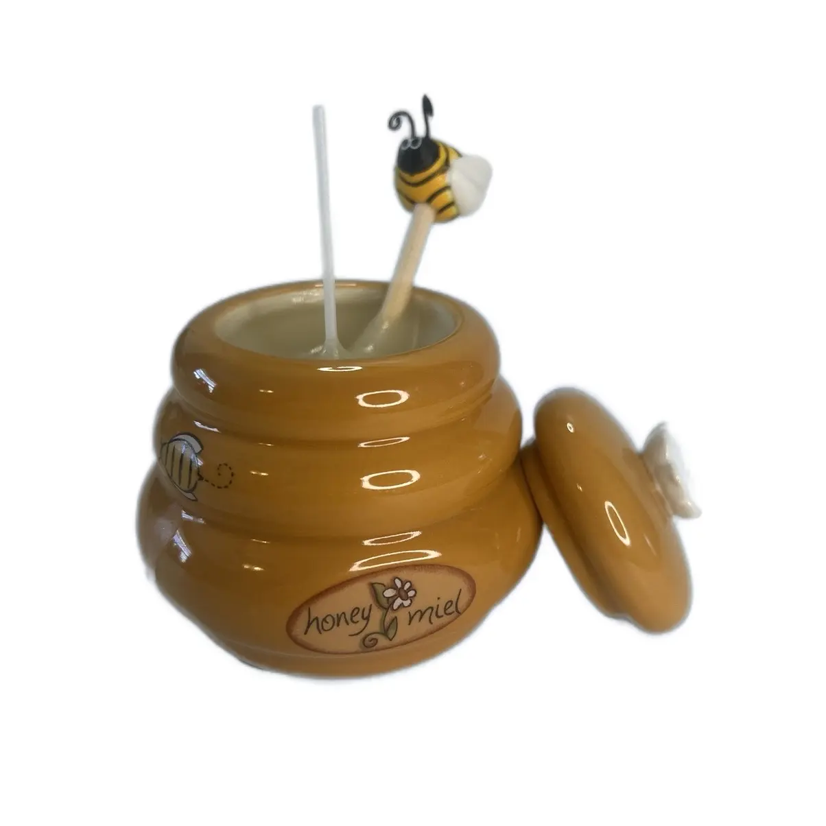 Beeswax candle in a honey pot Beeswax candle in a honey pot