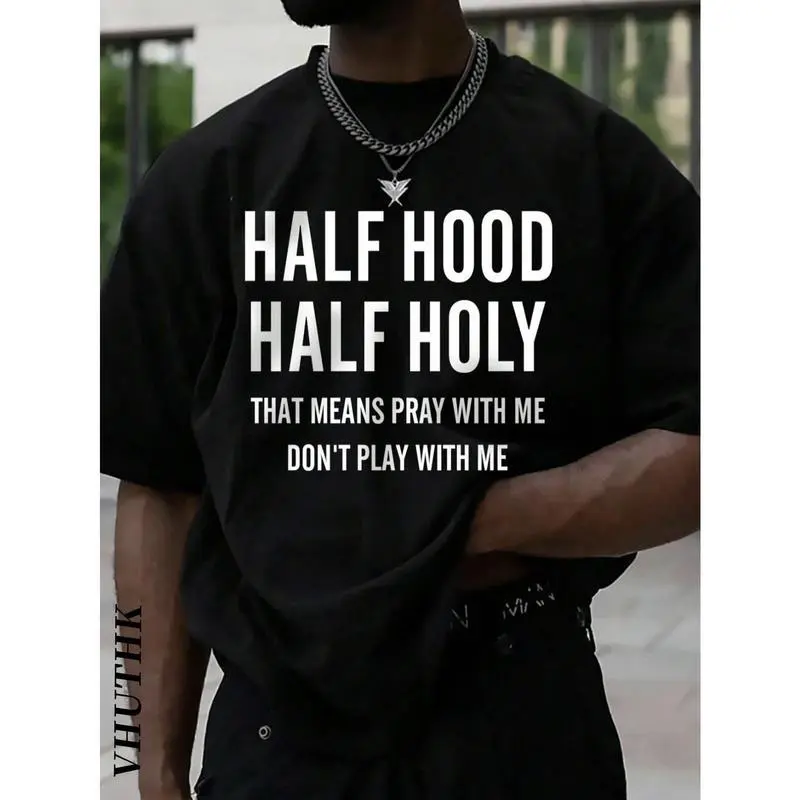 A T - shirt featuring the phrase “HALF HOOD HALF HOLY THAT MEANS PRAY WITH ME DON'T PLAY WITH ME”, showcasing a bold personal statement