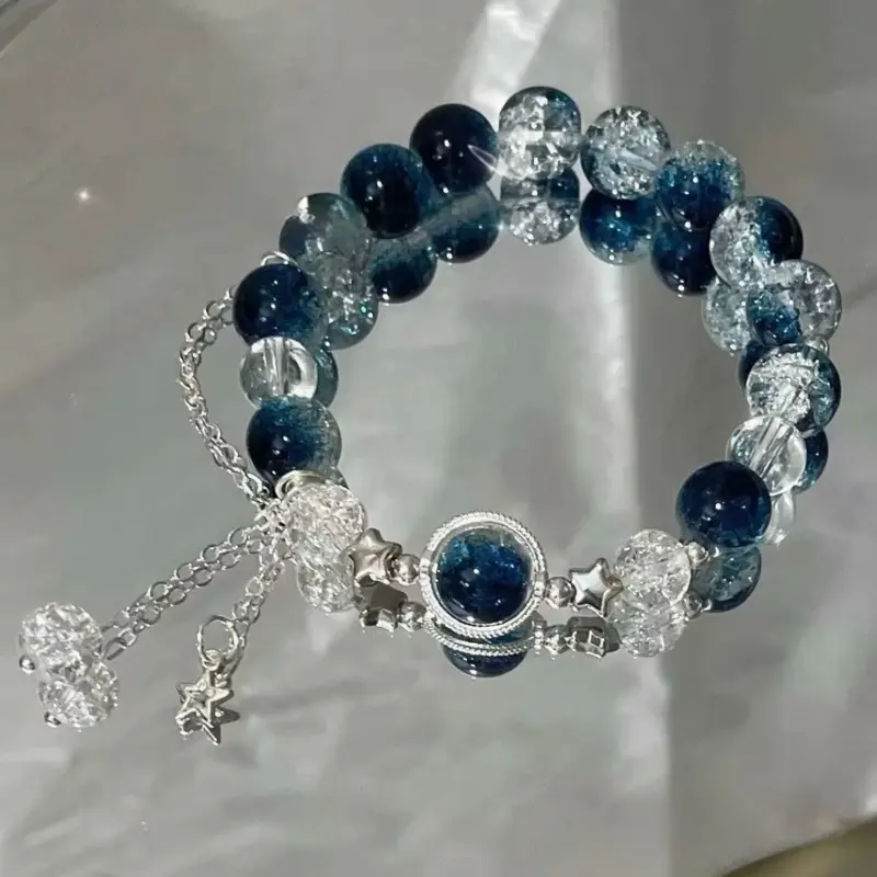 Beaded Bracelet with Blue and Clear Beads Featuring Star Charm and Silver Tone Chain for Stylish Accessory