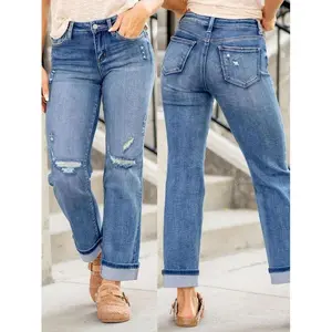 Women’s stretchy ripped jeans with rolled-up cuffs—trendy and fashionable for all seasons