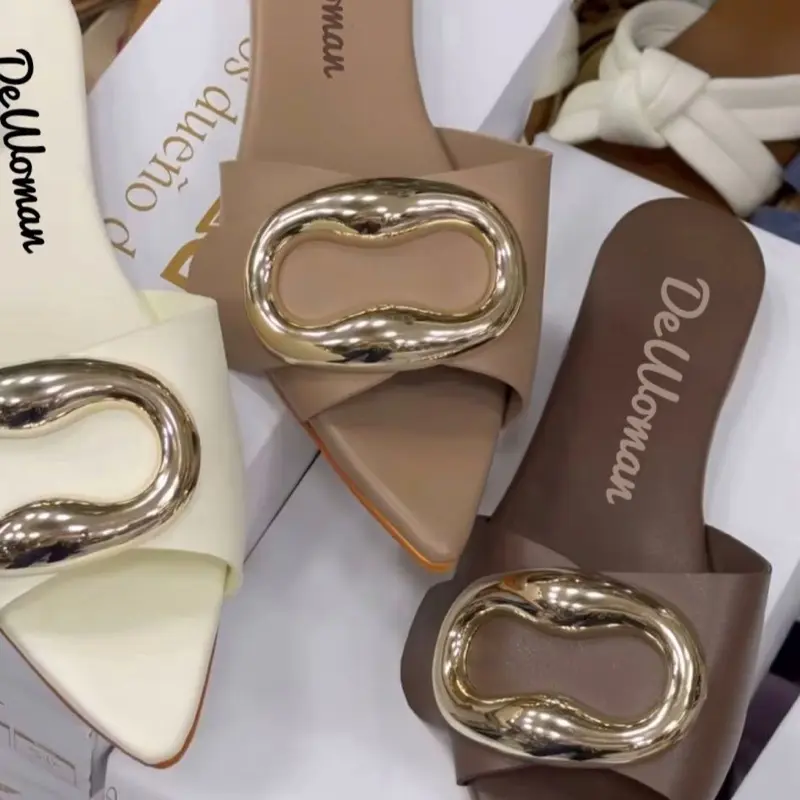 Dewoman Chic pointed-toe slip-on mules with a bold gold buckle detail