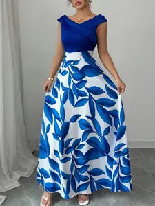 A sleeveless navy blue dress with blue and white leaf print panels and a V-neckline with a flared long skirt, Casual chic outfit, suitable for dinners, upscale dates, art exhibitions
