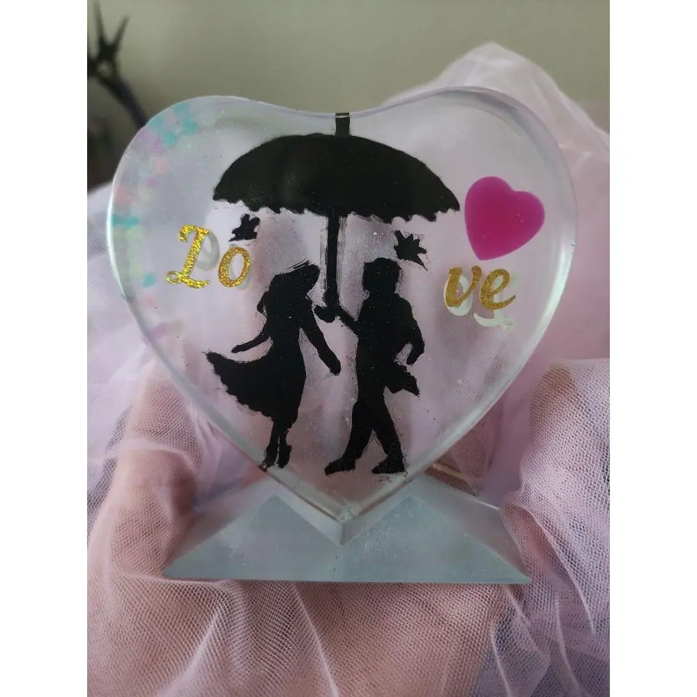 Pearl White Heart-Shaped Ornament with Silhouette Design and "Love" Text, $15