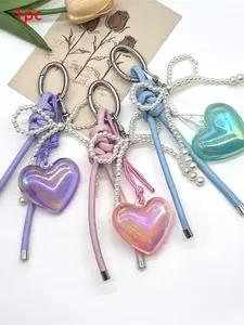 Gentle heart-shaped pendant, Bag charm keychain, Stylish Backpack Charm, with pearl bow decoration design, lightweight and easy to carry, suitable for decorating shoulder bags and crossbody bags, suitable for dates, and can be given as a gift to friends