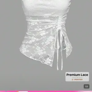 stylish, contemporary plus-size strapless top in a deep burgundy or wine-red shade. It blen