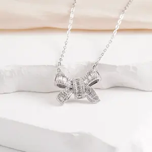 Ladies' Exquisite Silver Bow Necklace: An elegant "Coquette" style bow pendant featuring an adjustable chain. This minimalist, ribbon-inspired piece is a trendy and fashionable accessory—the perfect gift choice.
