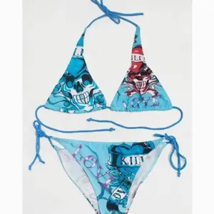 Inspired Skull Love Kills String Bikini Set – Turquoise Blue | Skull & Heart Tattoo All-Over Print | Halter Tie Top & Side-Tie Bottom | Y2K Vintage Grunge Swimwear | Women's Summer Beach Festival Outfit & Gift for Her