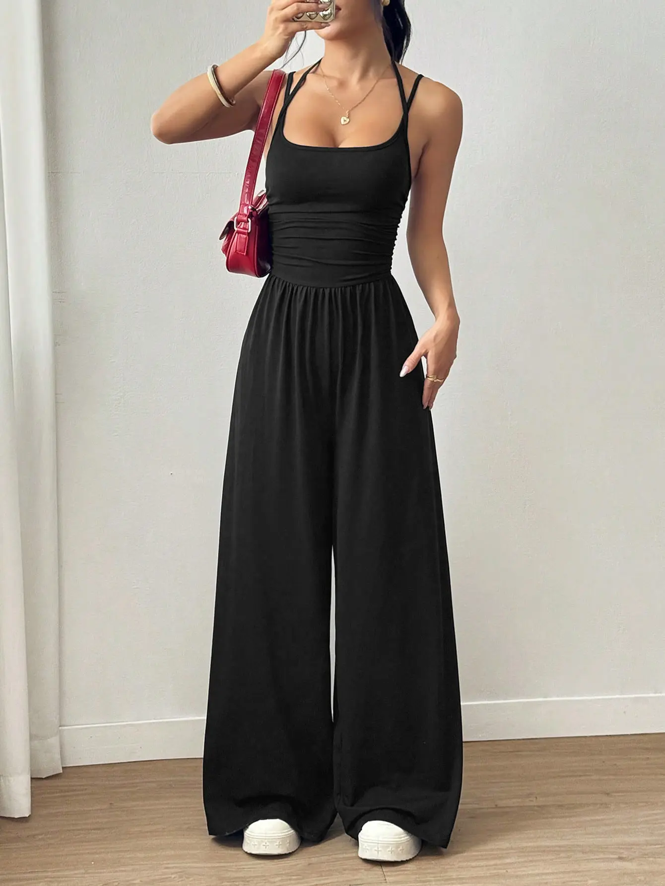 Available in multiple colors; spring/summer European & American casual women’s halter camisole jumpsuit with wide legs; ruched high-waist, drapey solid knit long jumpsuit; loose jumpsuit for everyday wear, commuting, and vacations.