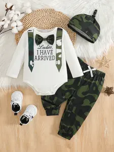 Baby boy autumn white long sleeved printed bag fart outfit paired with camouflage shoulder straps, pants, and same color hat, fashionable and cool to wear baby clothes