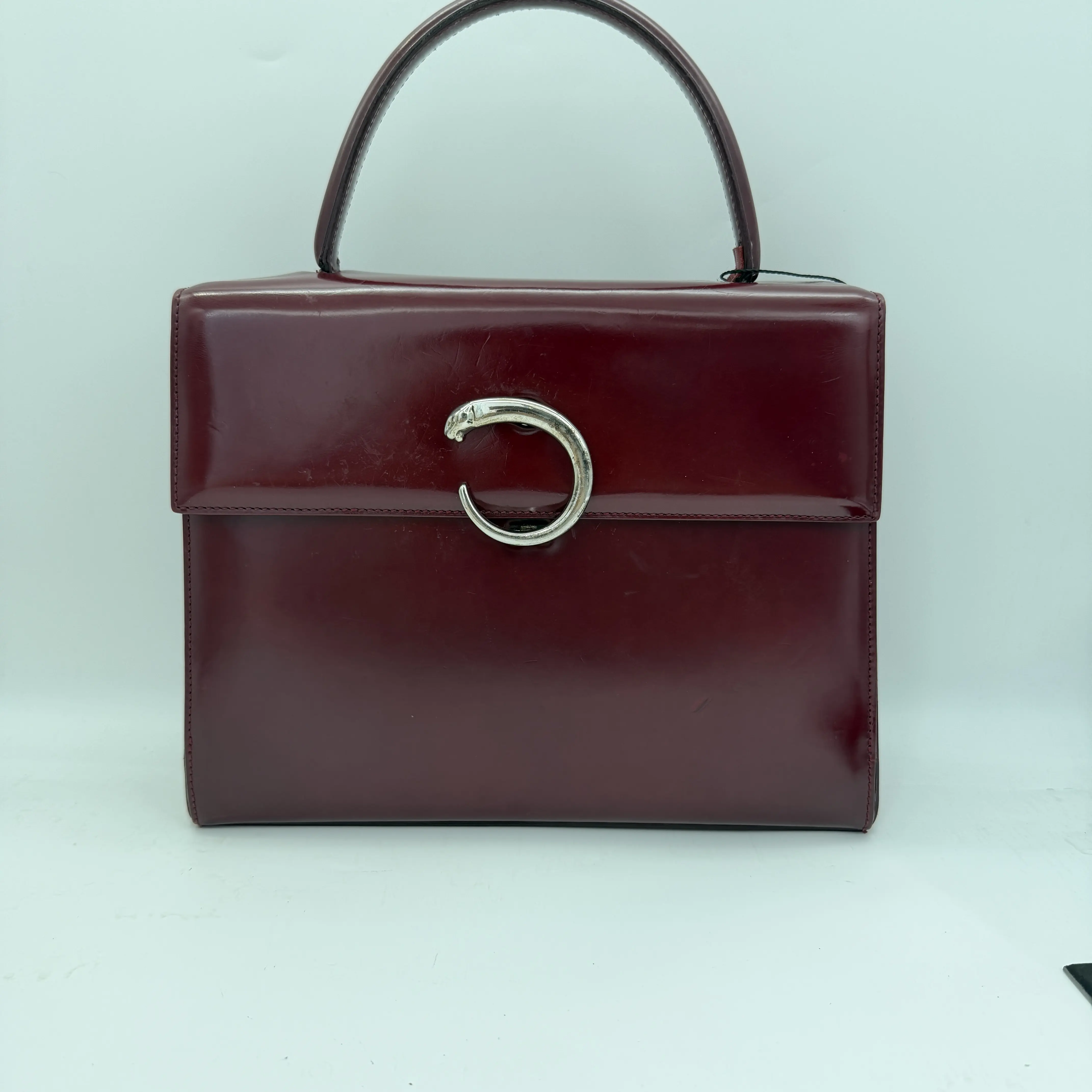 Pre-owned Cartier red handbag with panther head detail