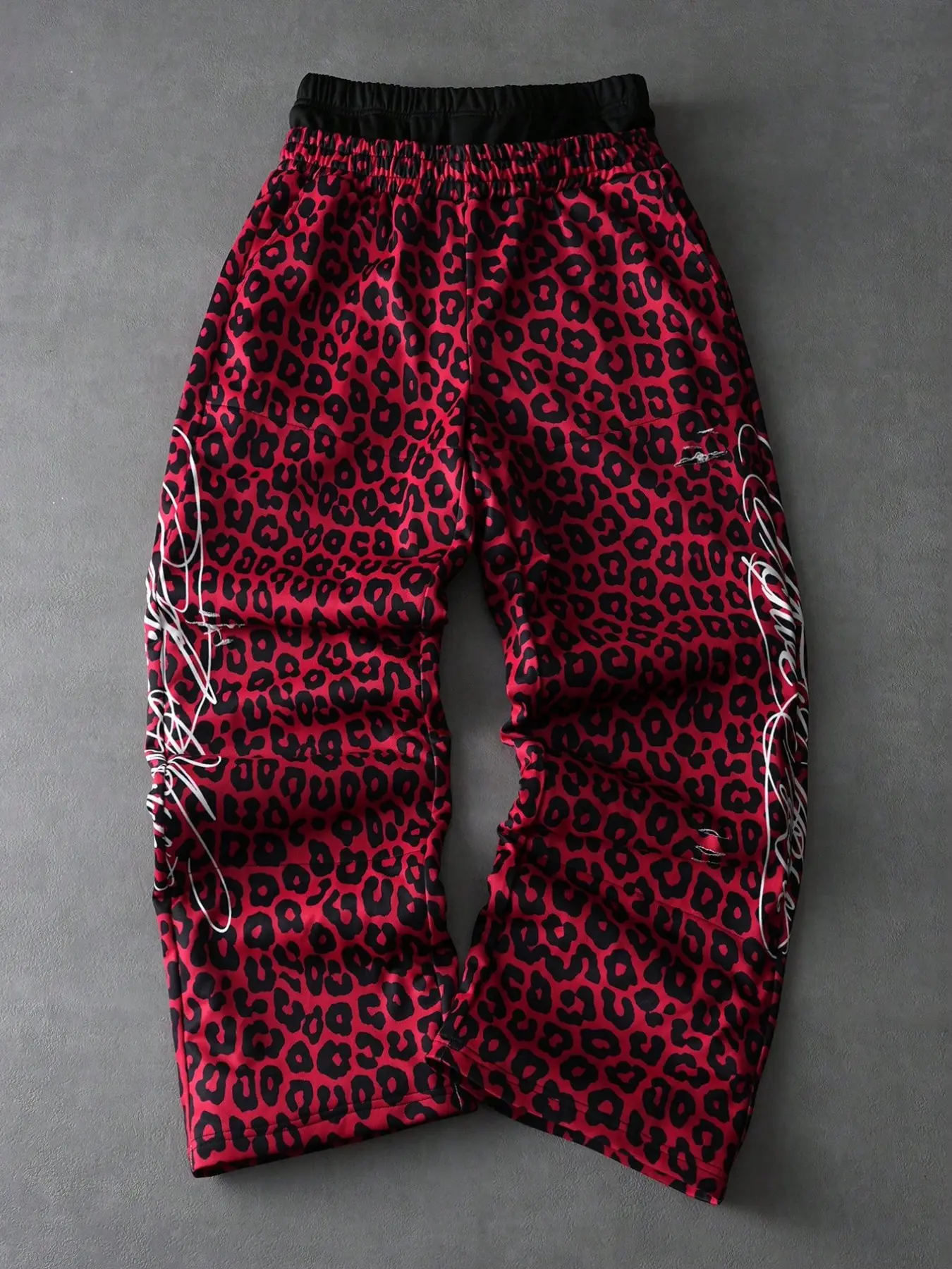 Men's and women's red leopard-print long pants for summer, loose-fitting athletic pants, Casual fashion trousers, Casual lounge pant, Dual waistband design, street style, wide-leg silhouette, hand-drawn print, relaxed look, All Season Trousers