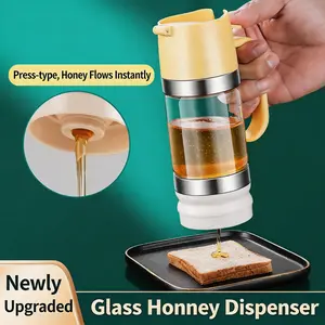Glass Honey Dispenser. Features a drip-proof, leak-proof sealed design and a convenient handle. Simple to operate; ideal for dispensing maple syrup, effectively locking in freshness; easy to clean.