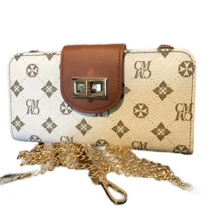 Women's zipup wallet with Gold Chain shoulder Strap and Monogram Design Brown Leather Accents. extra twist closure. Rf protection