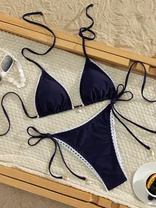 Ladies' summer beach dark blue two-piece bikini, solid color halter bikini top and bikini shorts, tempting sexy women's swimwear, holiday party fashion swimsuit.