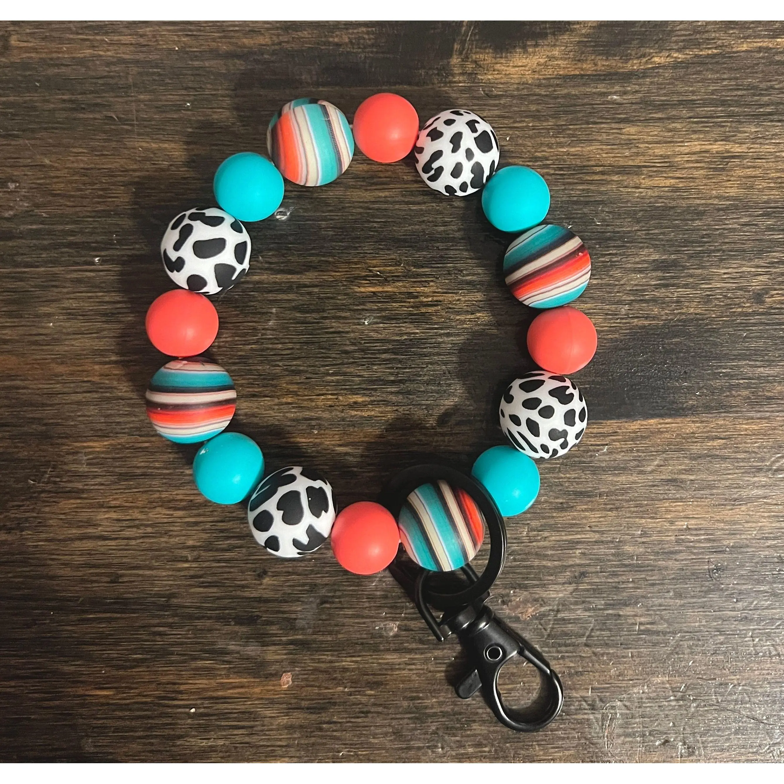 Serape Coral Cow Print Wristlet