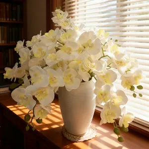 This pack of 6 large-petaled artificial Phalaenopsis orchids features an elegant and sophisticated pure white color. Maintenance-free, they are suitable for decorating living rooms, bedrooms, offices, weddings, parties, and event settings.