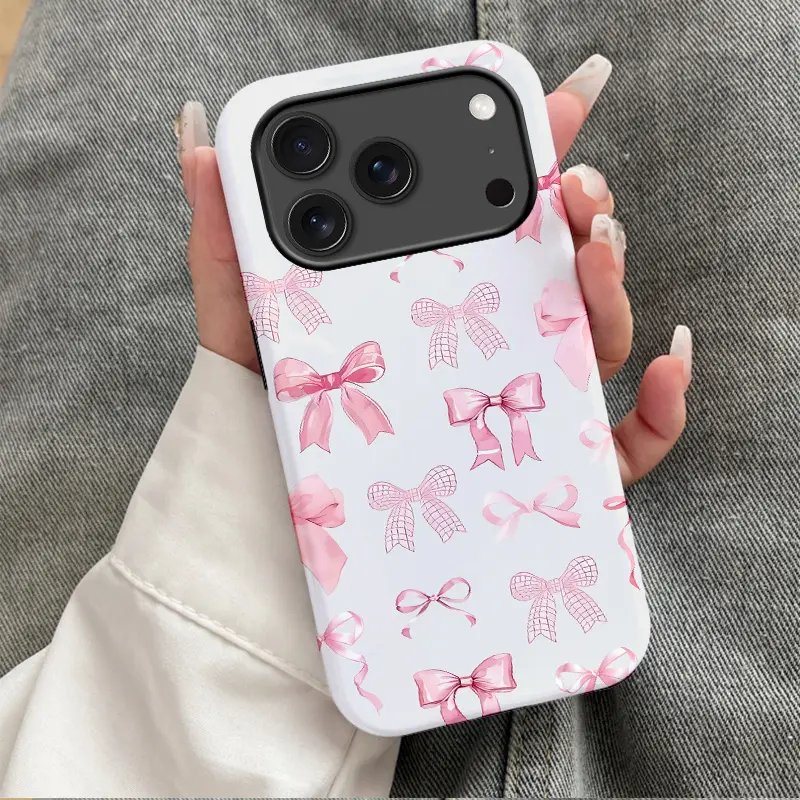 Pink checkered ribbon and bow design, durable and shockproof two-in-one phone case, suitable for iPhone 17, 16, 15, 14, 13, 12, 11, X, Samsung and other series models. Can be given as a holiday gift to friends or family.