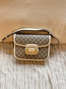 Pre-owned GUCCI Horsebit 1955 medium shoulder bag in white and monogram canvas in good condition
