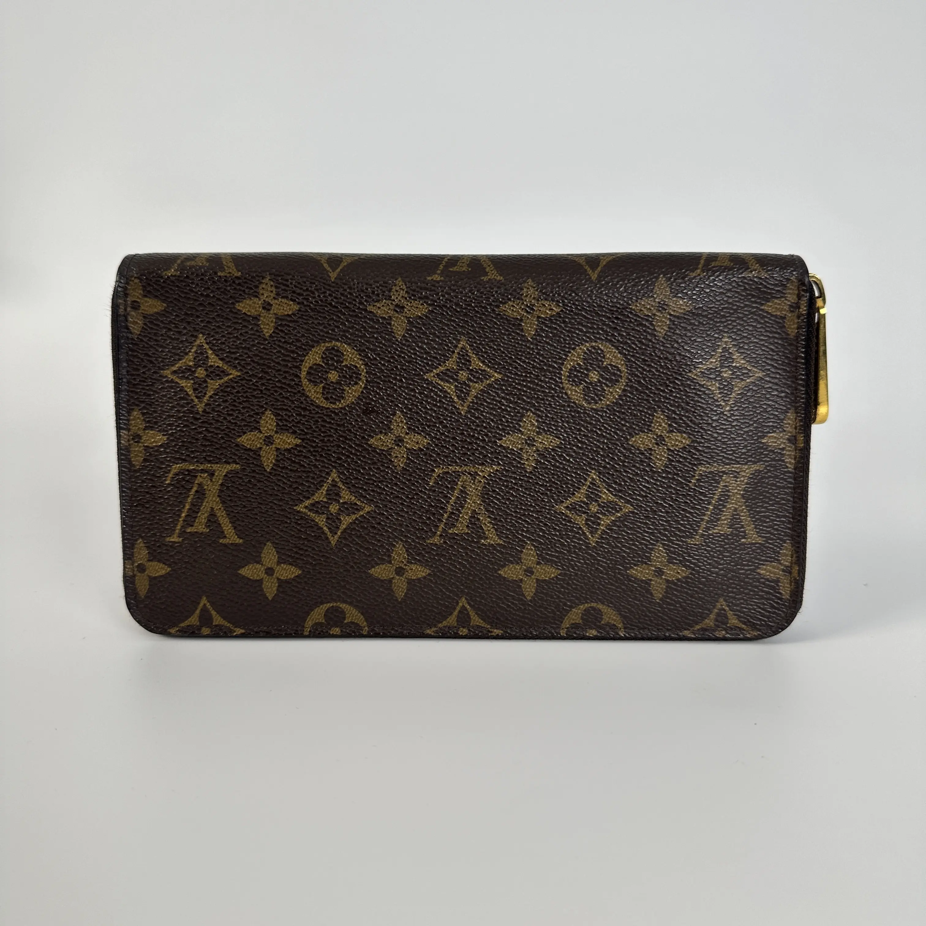 Pre-owned Louis Vuitton Leather Clutches and wristlets Clutches & Wristlets Zippy Wallet | Monogram Coated OH1093