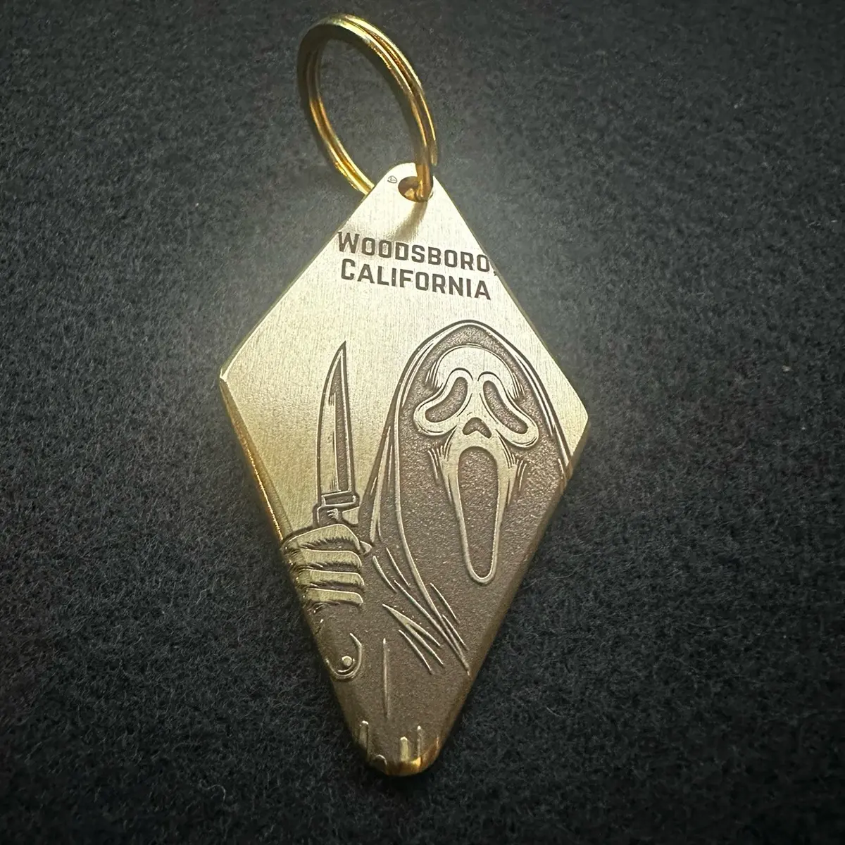 Scream Ghostface Brass Hotel Style Keychain - 2.75 inches long, 1.57 inches wide, and 3mm thick