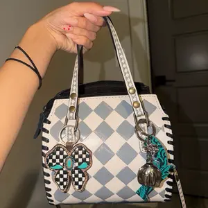 Mini Speedy Used Handbag with Checkerboard Design and Decorative Charms