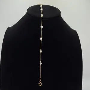 Pulsera color perla en oro 14K