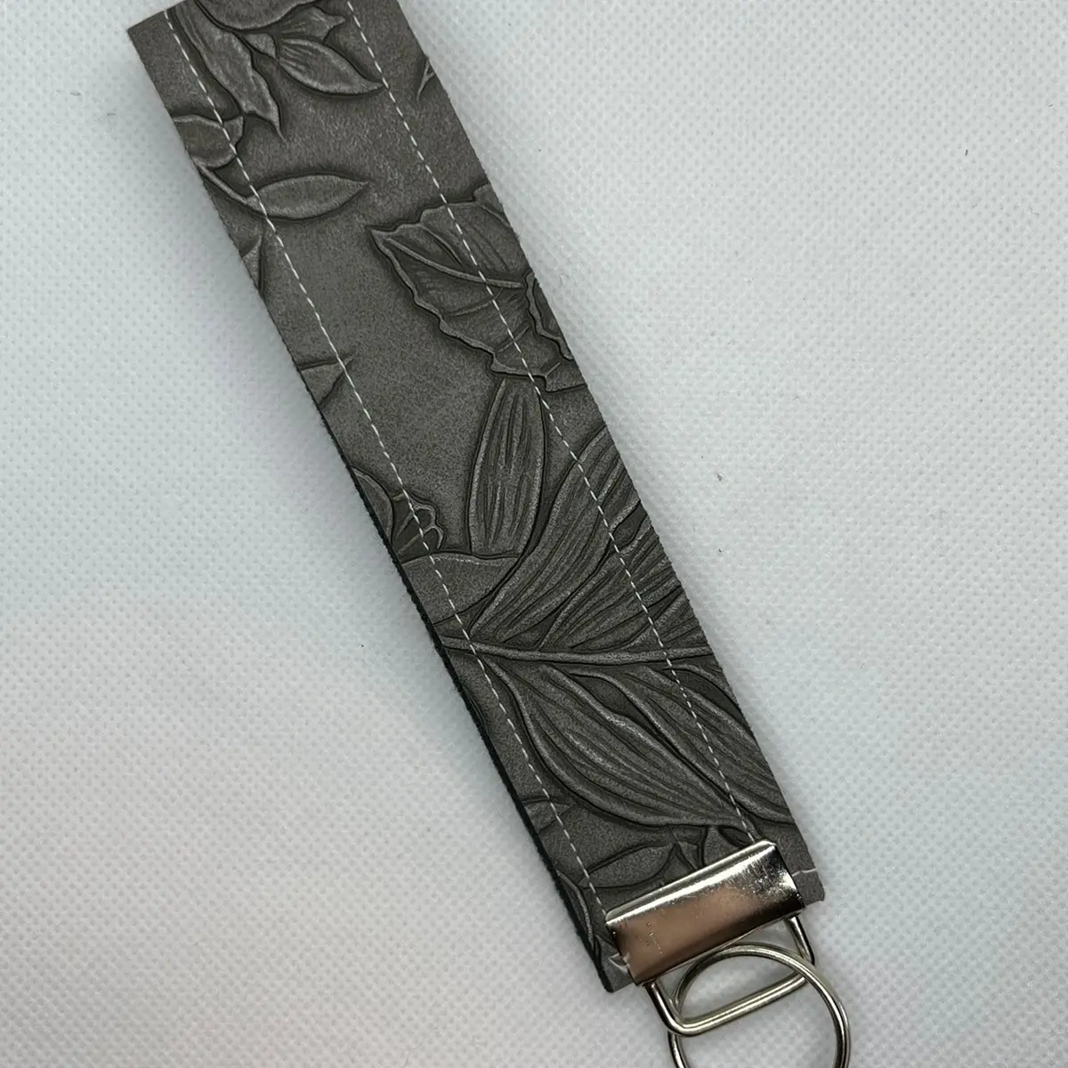 Leather floral wristlet Leather floral wristlet