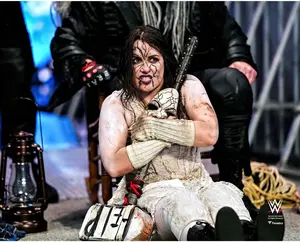 Nikki Cross WWE Unsigned Holding Mask & Ramblin' Rabbit's Mallet Photograph