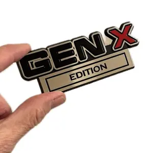 Gen X Edition Car Emblem. Red X, All Black or Chrome. 4" wide Made in America. Die Cut Adhesive. Easy Install for Gen Xers. GenX Merch