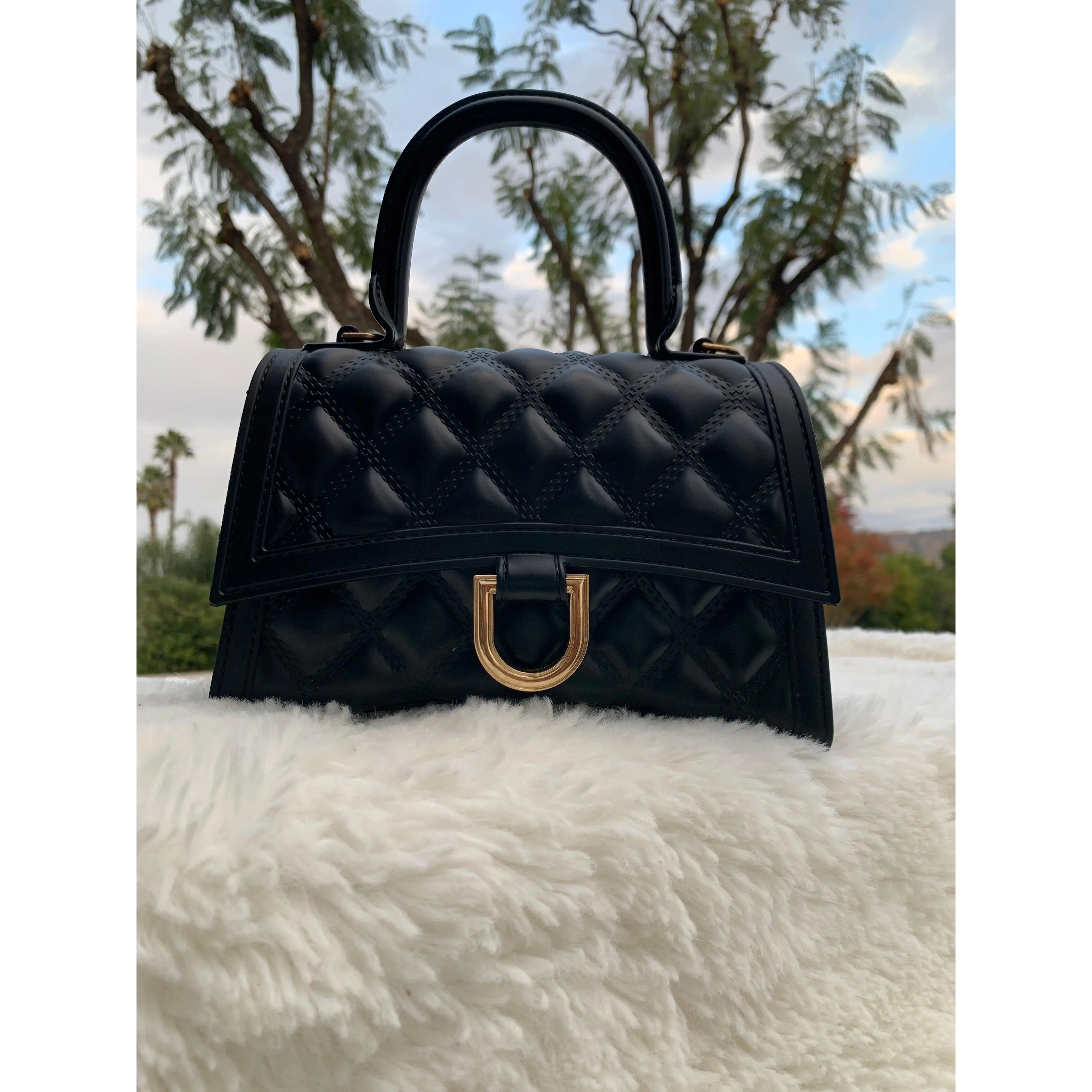 black Hourglass Top Handle with gold hardware
