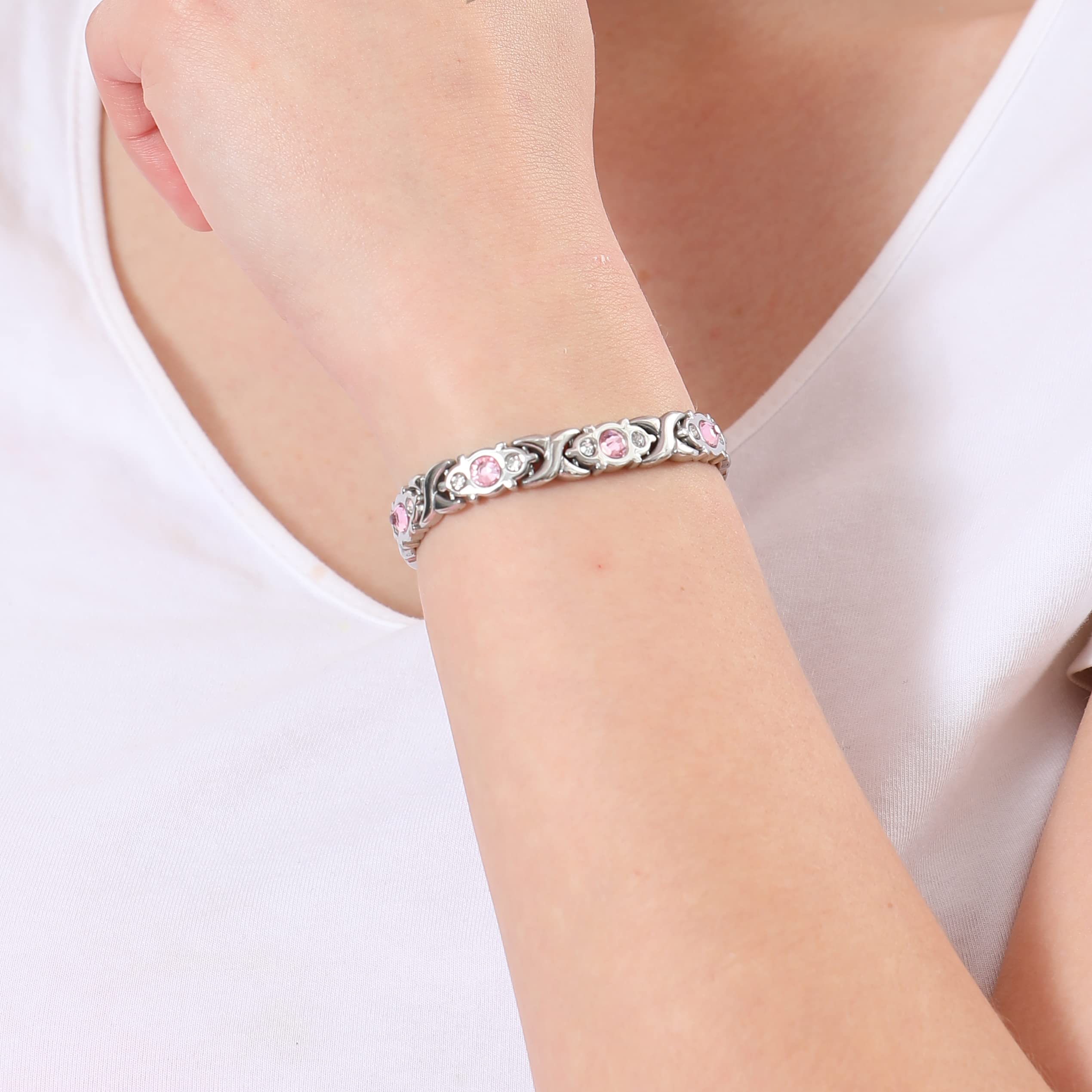 The energy magnetic bracelet is made of eco-friendly alloy materials and is studded with diamonds. It has an adjustable wristband and is an ideal gift for couples.