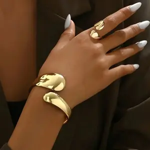 Trendy Lab 14K gold-plated alloy ring and bracelet set, featuring an adjustable opening design, suitable for women to wear on various occasions, showcasing timeless elegance, and high-quality gold-plating craftsmanship