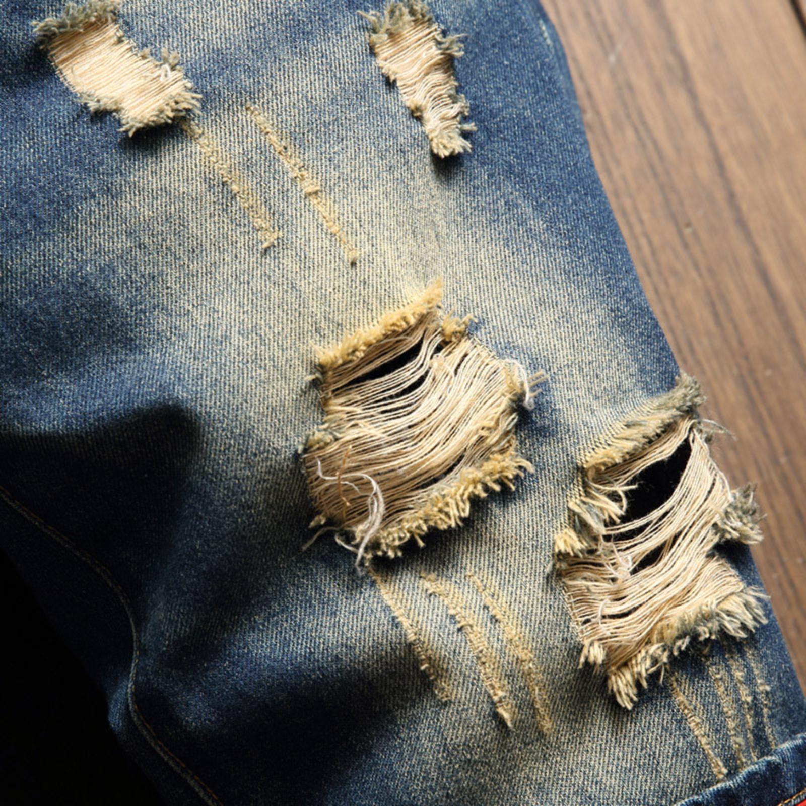 Bleached distressed denim mid-rise shorts with no stretch, multiple rips, raw hem, red-edge print lining—trendy five-inch inseam