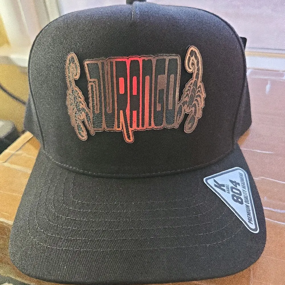 Gorra durango,   color obscuro  marca kamel ajustable
