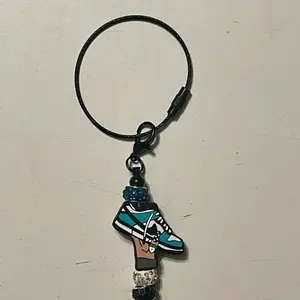 Icy Kicks: Teal & Black Sneaker Keychain with Bling