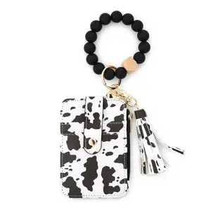 Trendy Cowprint Wristlet Keychain Wallet | TikTok Made Me Buy It Western Card Holder | Spring Fashion Essential#TikTokFinds #ViralTikTok #WesternAccessories #CowPrint #BeadedWristlet #TikTokMadeMeBuyIt #EverydayCarry #WristletWallet #CardHolder
