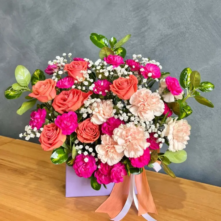 Berry Peachy Flowers - Dazzling Floral Bouquet in Stylish Pastel Box with Coral Roses & Peach Carnations for Special Occasions