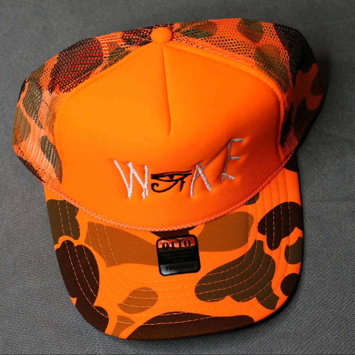 Embroidery Woke Trucker Hat (Neon Orange)