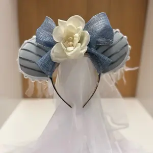 Haunted Mansion Inspired Ears with Blue and Gray Design, White Flower Accent, and Decorative Bow