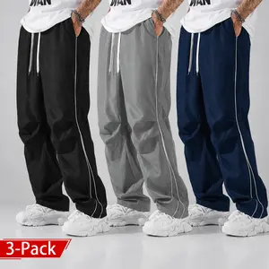 3-pack men’s casual long pants featuring a loose fit, drawstring elastic waistband, and tie straps on both pant legs; outdoor casual street-style wide-leg pants that are versatile for four different outfits.