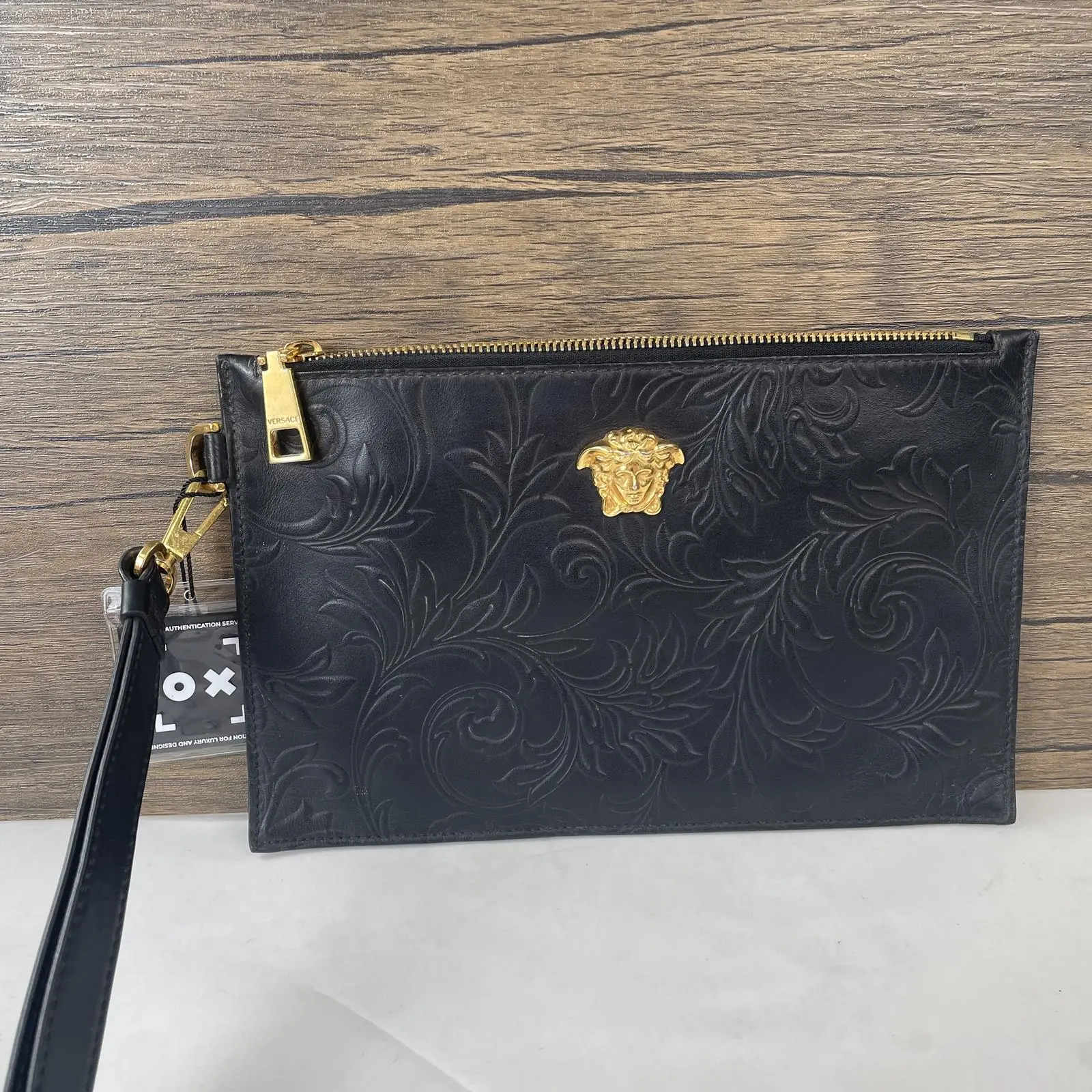 Pre-owned VERSACE Leather Clutches & Wristlets Black Medusa Clutch with Embossed Floral Pattern and Wristlet