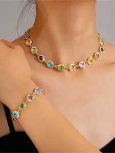 Rainbow Gemstone Jewelry Set | Golden Crystal Necklace + Bracelet, Ultimate Rainbow Shine Effect. This set of matching necklace and bracelet features a colorful gemstone and crystal border design, making it perfect for music festivals, parties, or everyda