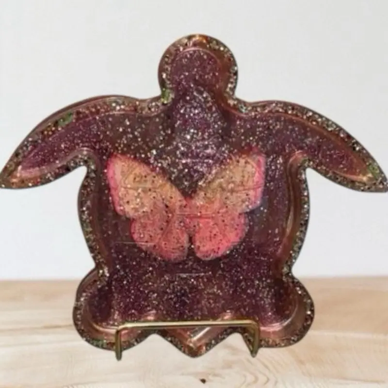 Pink glittery sea turtle ashtray with butterfly in the middle