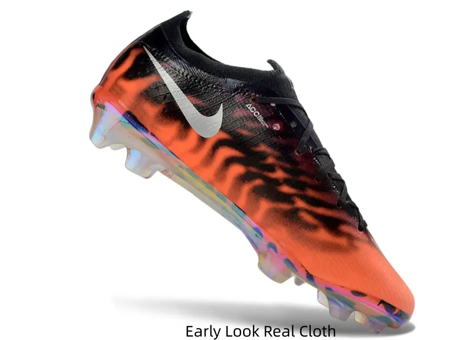 Fiery orange tiger stripe soccer cleats, iridescent rainbow sole grabs all eyes on the pitch