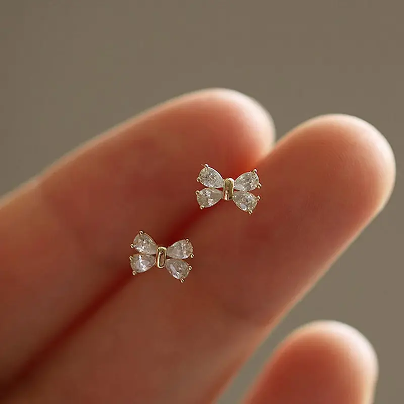 1 Pair Dainty Mini Bowknot Cubic Zirconia Stud Earrings, Cz Earrings, Shining Earrings, Tiny Bow Shape Shiny Inlaid Stone Post Earrings, Sweet Minimalist Daily Casual Costume Piercing Ear Accessories For Women, Studs Earrings
